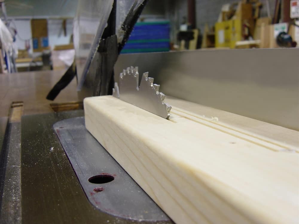 Rig up a dust port underneath your table saw