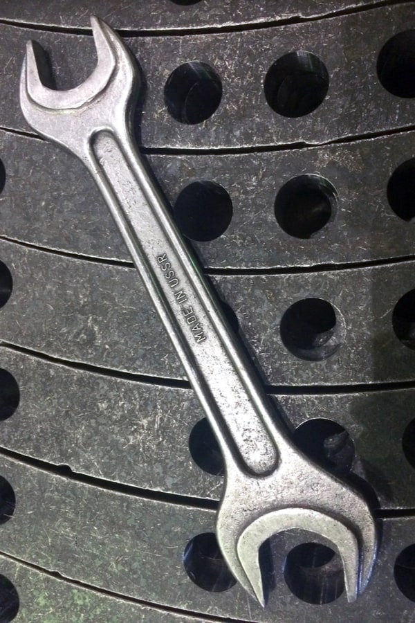 Use an open-ended wrench